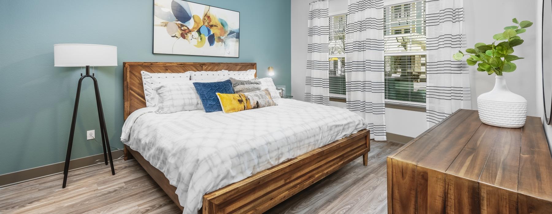 a bedroom with a bed and a table