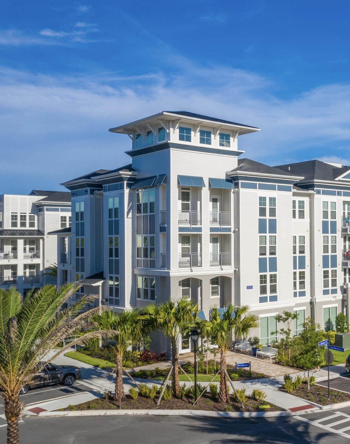 a building with cars parked in front