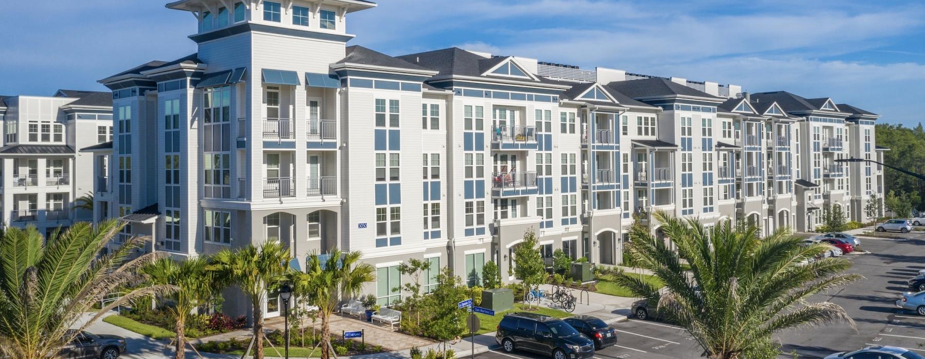 a building with cars parked in front